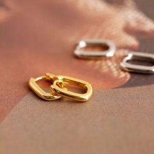 Flat gold oval hoop earring